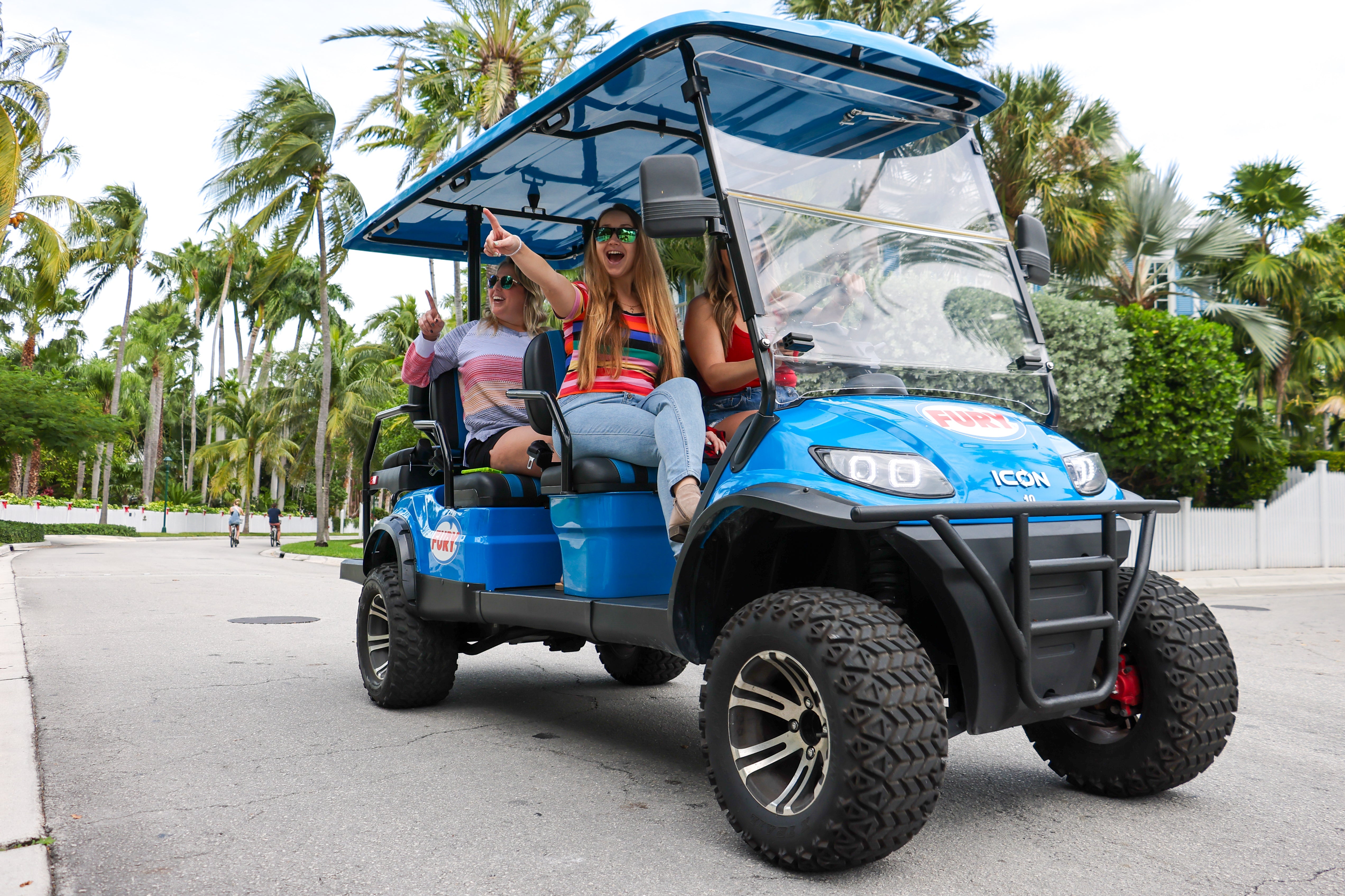 Fury Golf Cart parked in sunny Key West, Florida, ready for rental adventures around the island.
